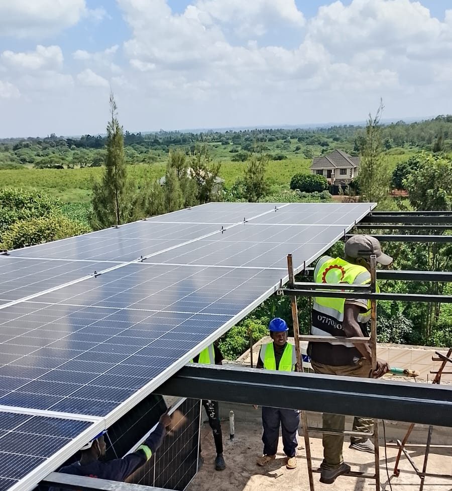 Alimo Engineering team installing a rooftop solar panel array